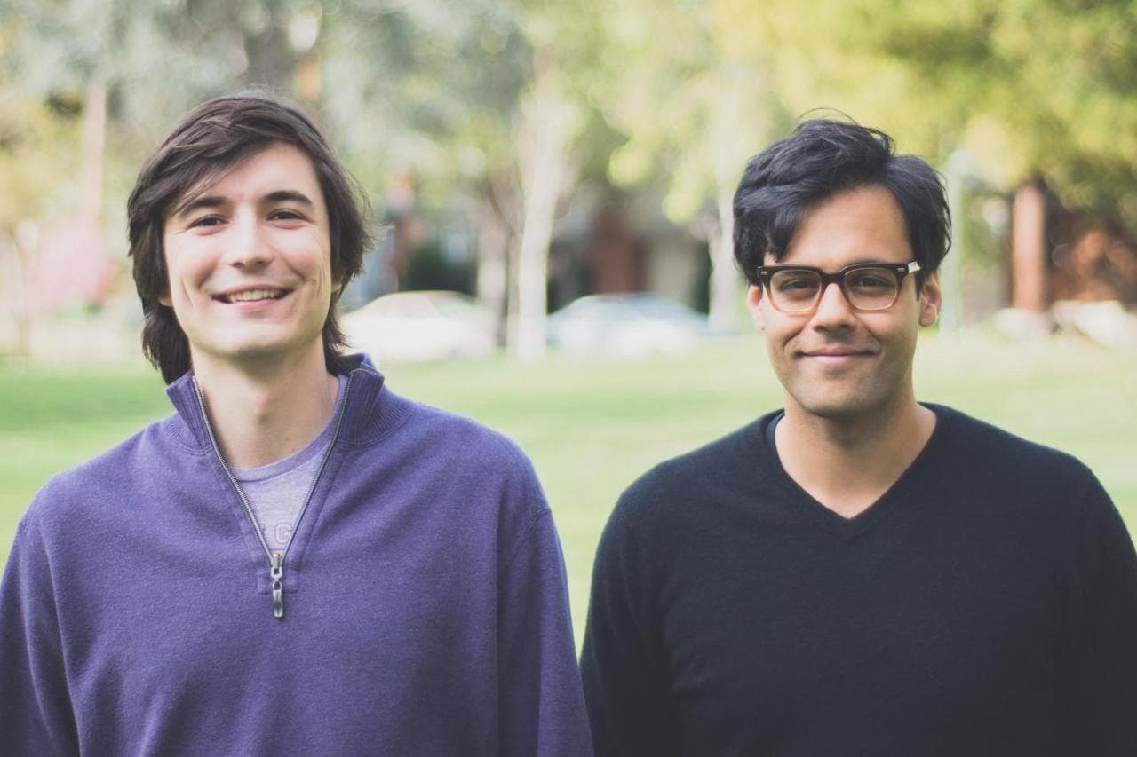 Robinhood co-founders Vladimir Tenev, left, and Baiju Bhatt in a sunlit park.
